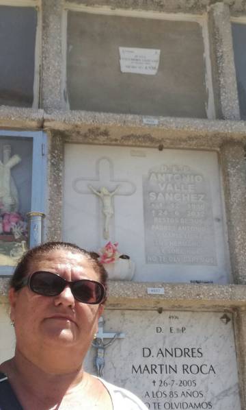 Juana Escudero Lezcano beside the tomb of her namesake.